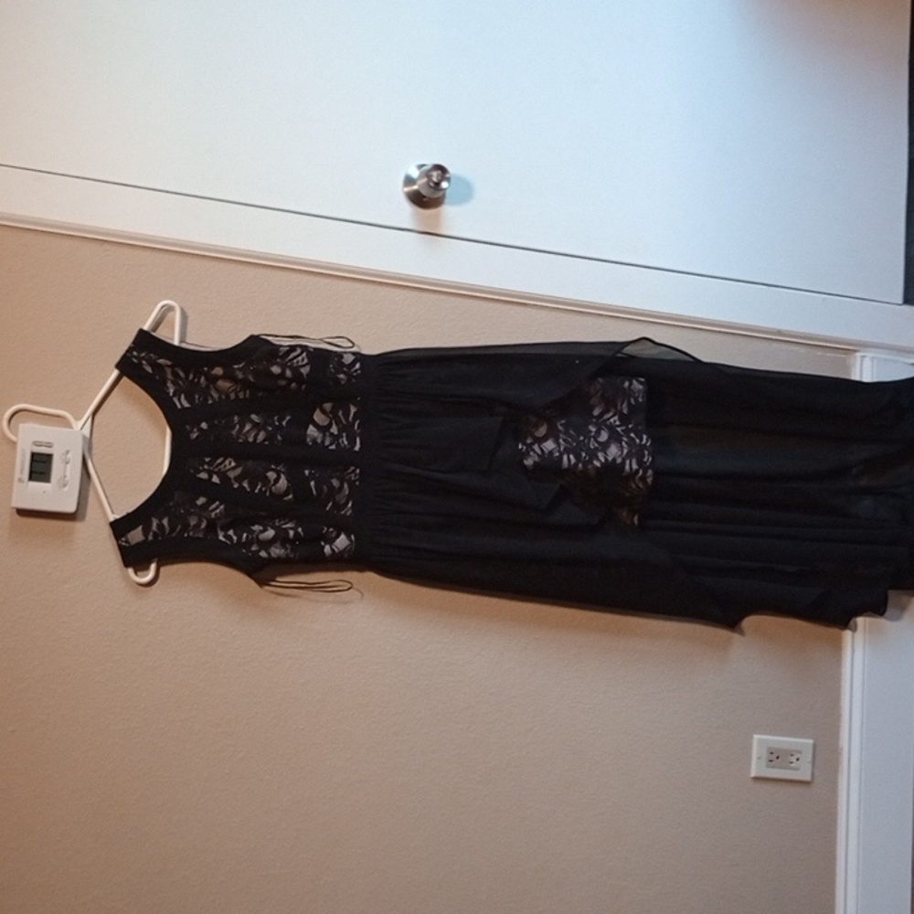 It' is a beautiful long black dress that you would like